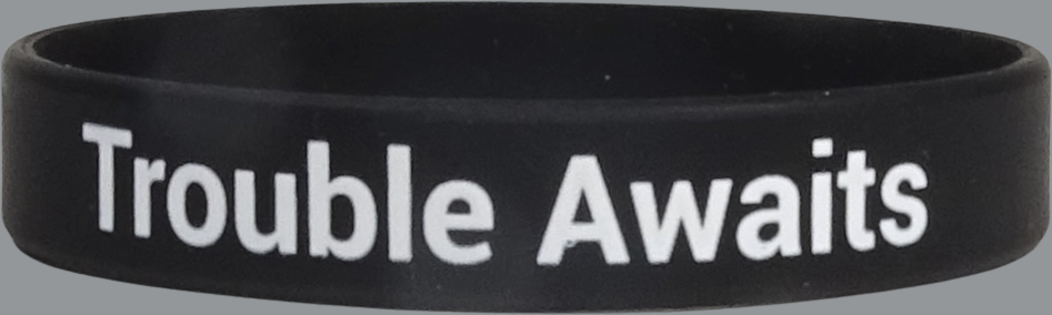 Black wristband with 'Trouble Awaits' text on a gray background