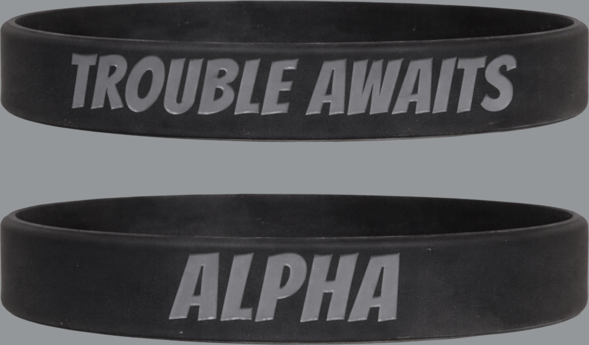 Two black wristbands with 'TROUBLE AWAITS' and 'ALPHA' text on a gray background