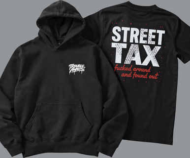 A product-style image shows two black garments arranged side by side against a neutral gray background. On the left is a black pullover hoodie with a relaxed fit, featuring a front kangaroo pocket and a small white “Trouble Awaits” graffiti-style logo printed on the left chest. 

On the right is a black short-sleeve T-shirt shown from the back. It features a large, bold graphic reading “STREET TAX” in distressed white text. Below it, in red script text, is the phrase “fucked around and found out” 
