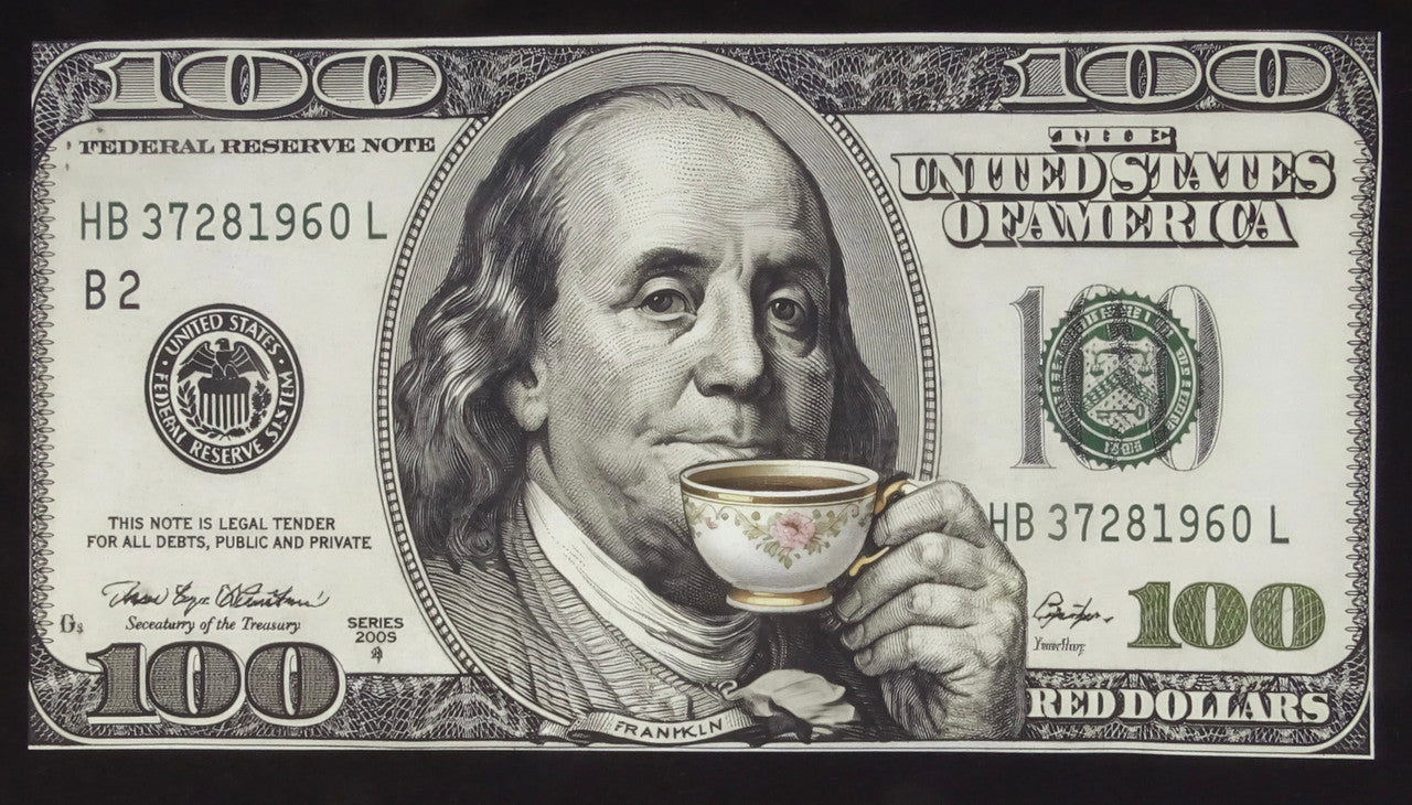 Illustration styled like a United States $100 bill featuring Benjamin Franklin in the center portrait. In this edited version, Franklin is shown holding and sipping from a small teacup with a floral pattern and gold rim. The rest of the bill includes typical $100 bill details such as the “100” numerals, the text “United States of America,” and decorative borders.