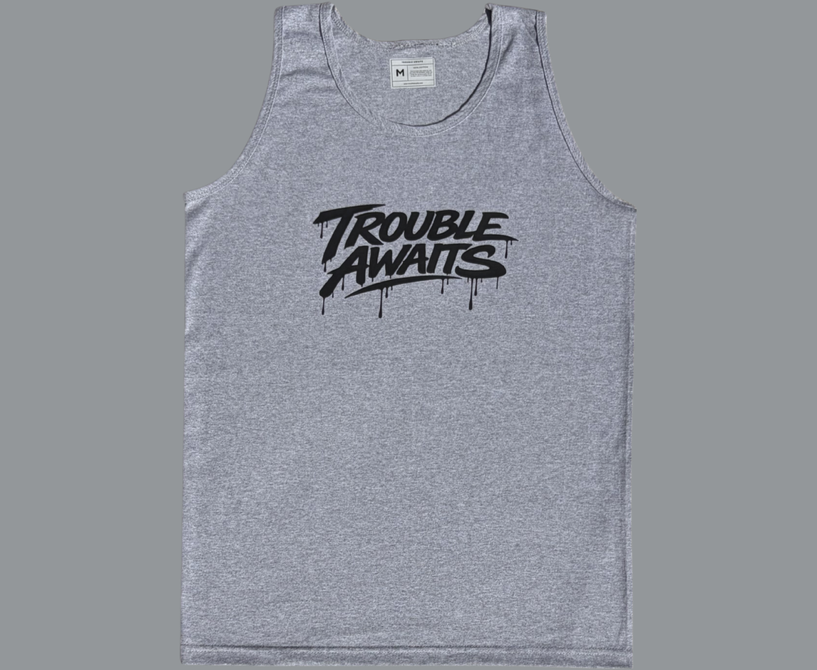 A sleeveless tank top is displayed flat against a plain gray background, shown from the front. The garment has a relaxed, straight fit with wide shoulder straps, large arm openings, and a rounded scoop neckline. A size label is visible inside the collar at the back of the neckline.

The fabric is heather gray, featuring a subtle mixed-tone texture typical of blended cotton materials. The surface appears soft with light
Centered across the chest is a large black logo
