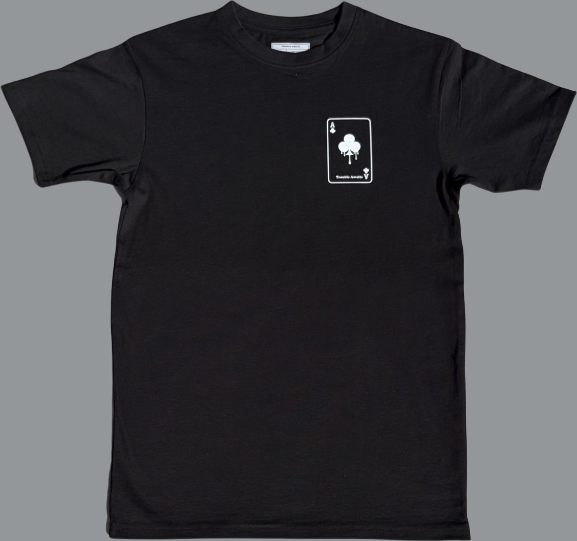 Black t-shirt with a white graphic on a gray background