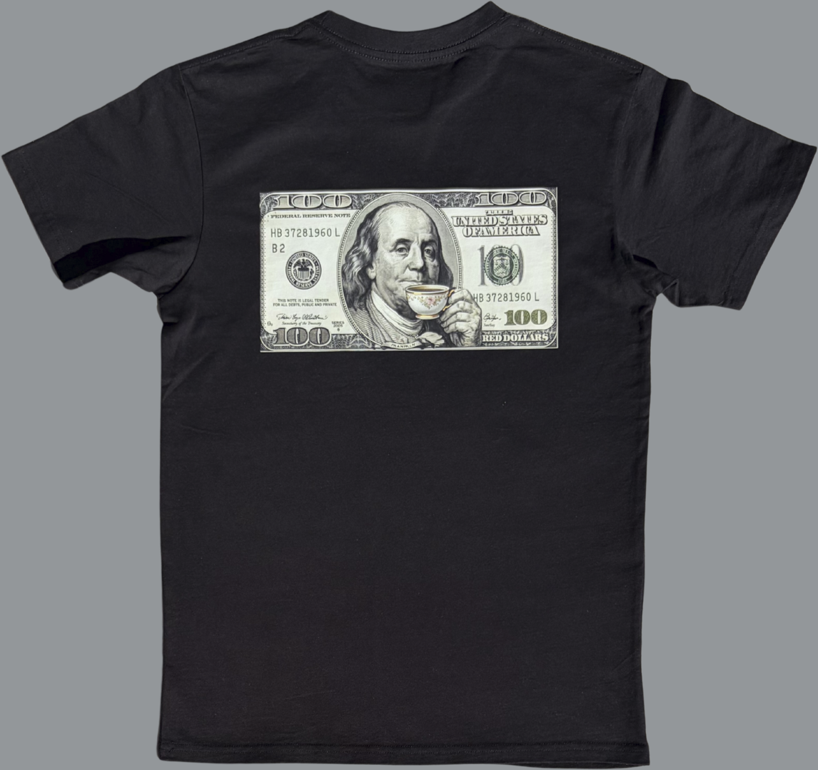 Black short sleeve t-shirt featuring a rectangular graphic printed across the upper back. The graphic resembles a United States $100 bill and includes a stylized image of Benjamin Franklin holding and sipping from a small teacup. The rest of the shirt is plain black with no additional visible graphics.